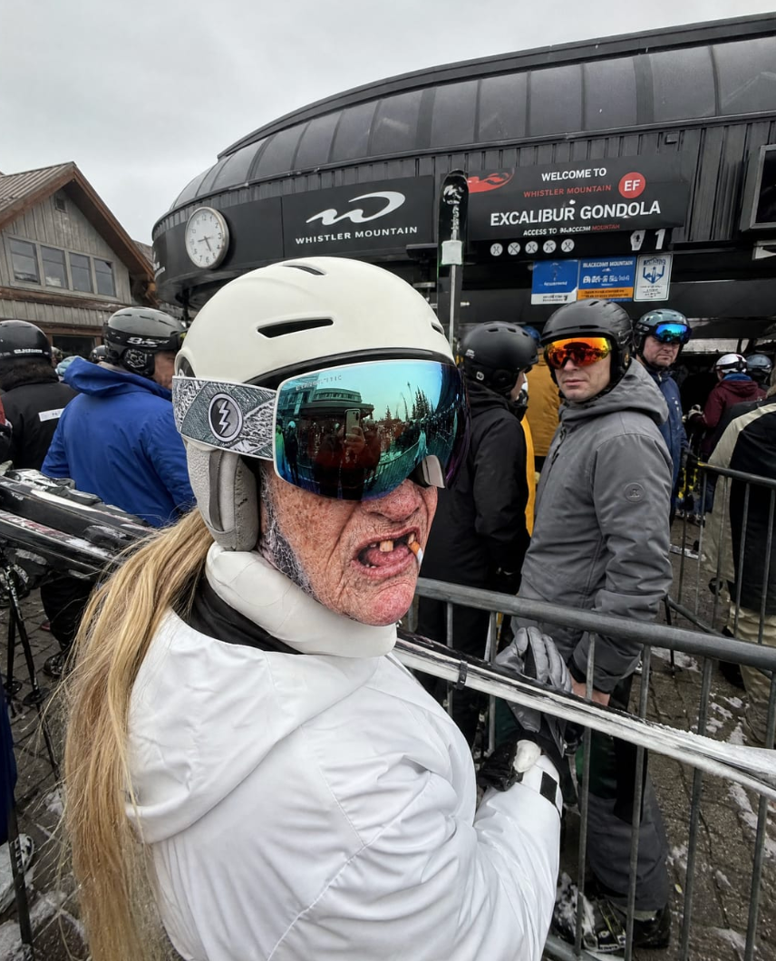 Happy skier or snowboarder